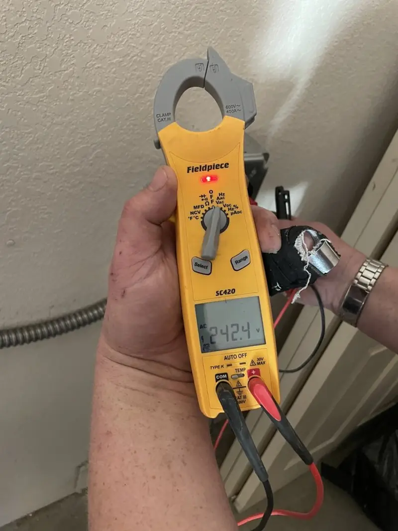 Voltage testing with clamp meter during Ceiling Fan Installation in Garfield Heights